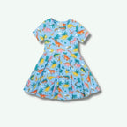 Children's dress with dinosaur pattern on a light blue background