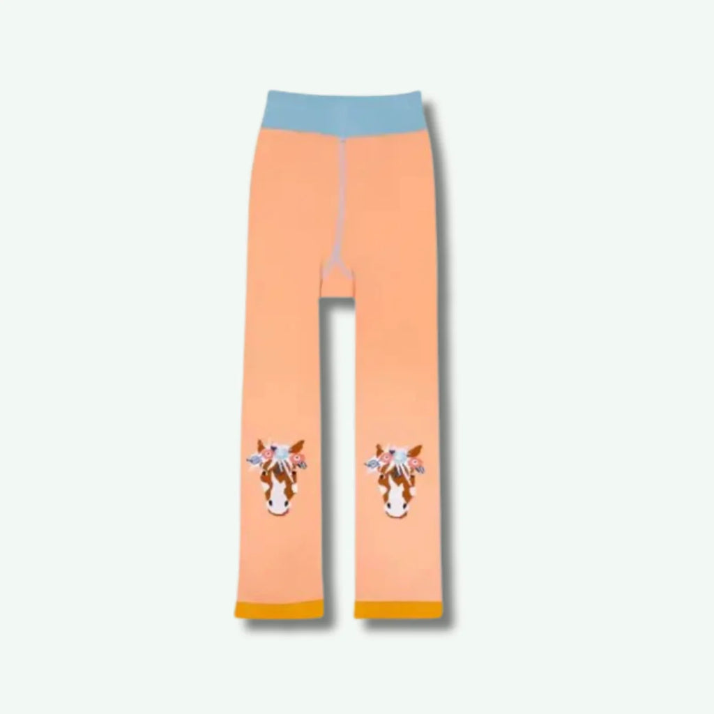 Peach-colored leggings with horse designs on a white background