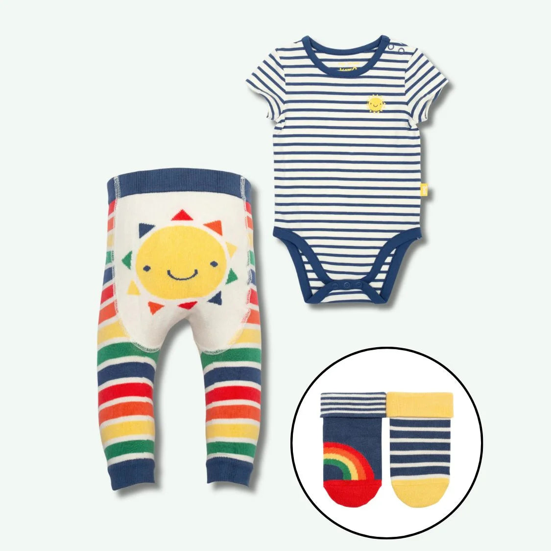 Baby outfit set with striped bodysuit and rainbow pants on a white background