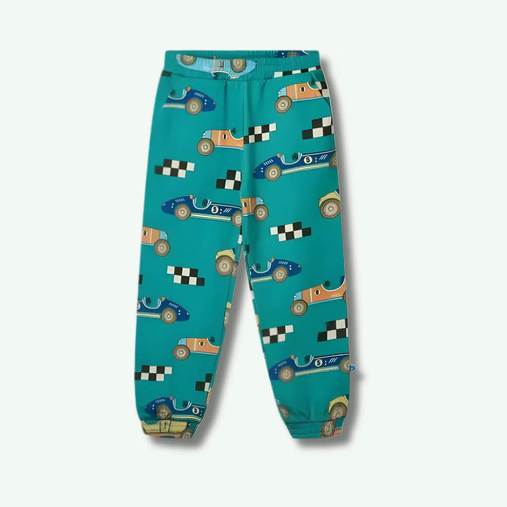 Teal children's pants with race car pattern on a white background