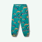 Teal children's pants with race car pattern on a white background