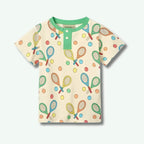 Children's t-shirt with tennis racket and ball pattern on a beige background