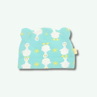 Baby bib with duck pattern on a light blue background