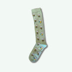 Green sock with bee pattern on a white background