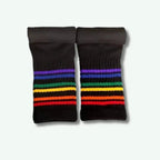 Pair of black socks with rainbow striped pattern on a white background
