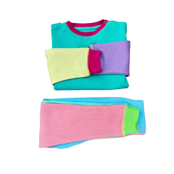 Colorful folded clothes on a white background
