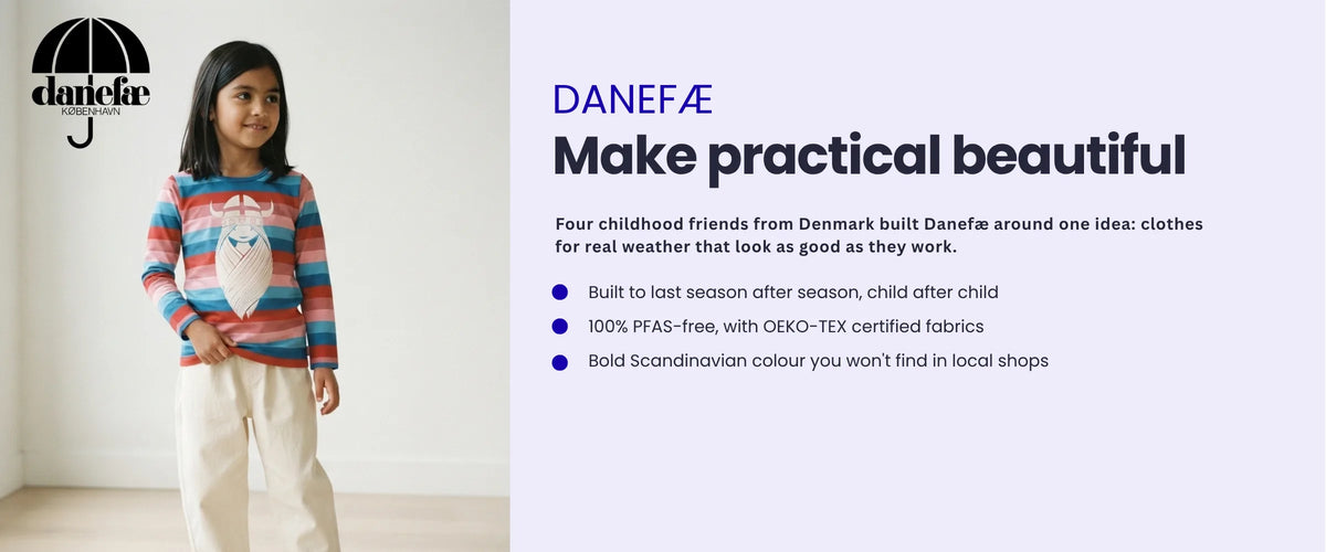 Girl in a Danefæ striped top with a Viking print. Danefæ, make practical beautiful. Danish clothes for real weather. Built to last child after child, 100% PFAS-free with OEKO-TEX certified fabrics, bold Scandinavian colour.