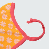 Clover print baby bonnet in radiant yellow with hot pink trim, DUNS Sweden – newborn clothing summer, infant clothes unisex