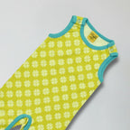 Green baby romper with white floral pattern on a light gray background