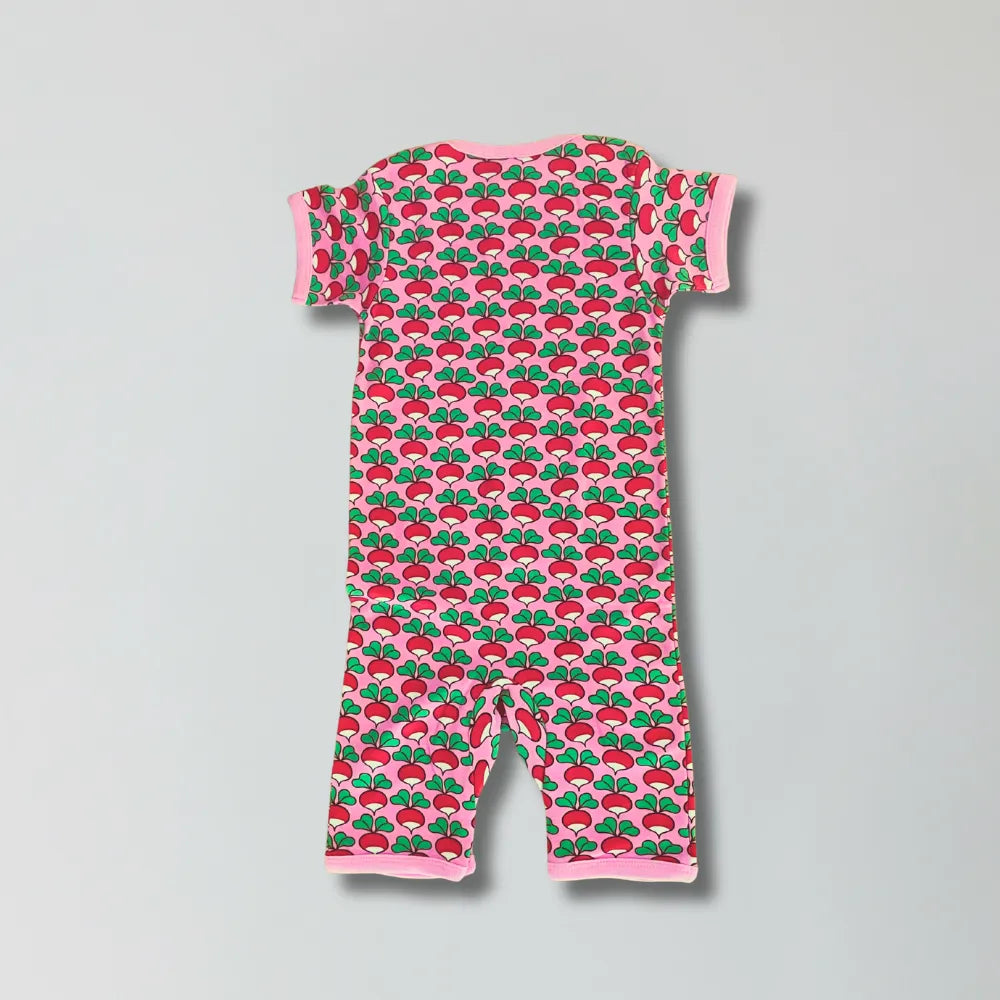 Baby romper with radish pattern on a gray background