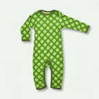 Green baby onesie with clover pattern on a white background
