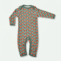 Children's onesie with red mushroom pattern on a green background