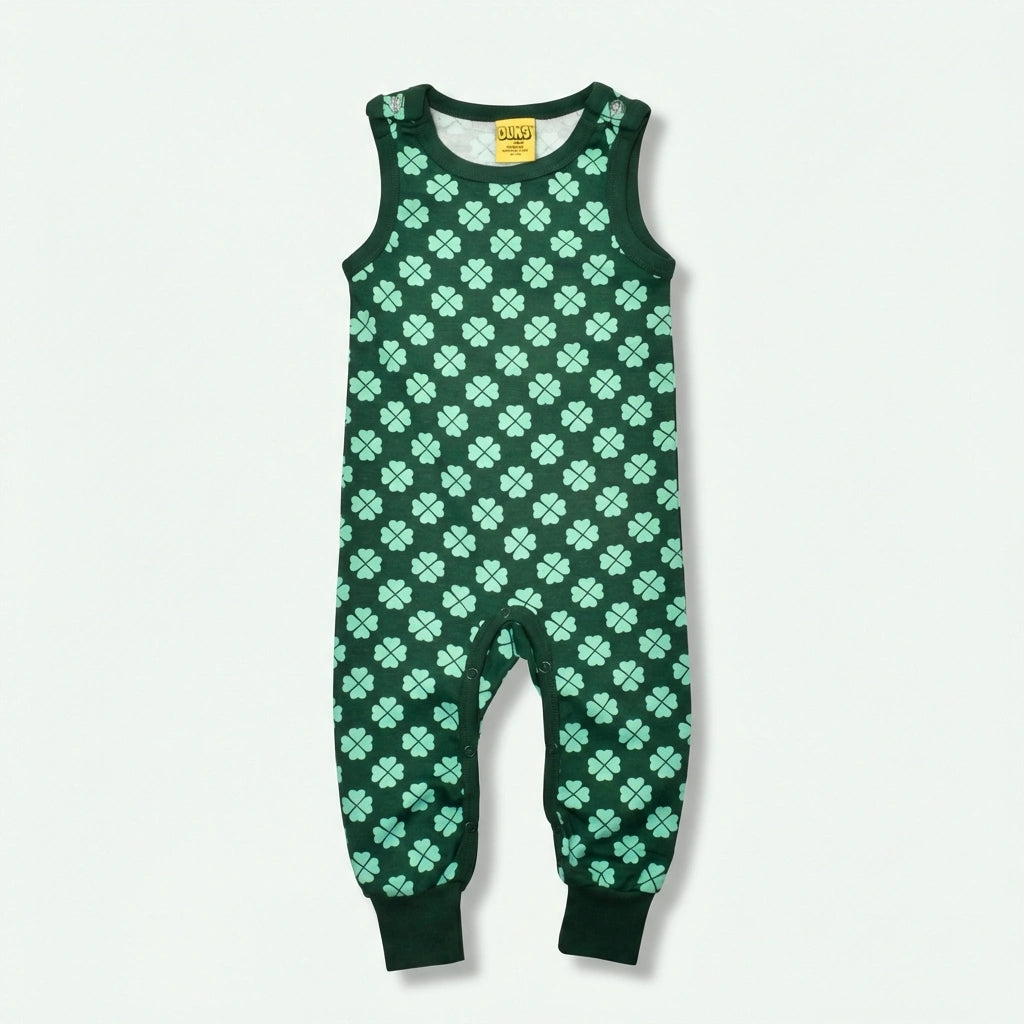 Green romper with clover pattern on a white background