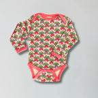 Baby onesie with radish pattern on a gray background