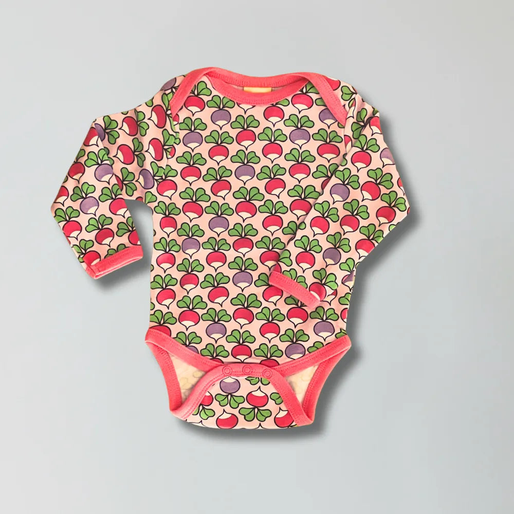 Baby onesie with radish pattern on a gray background