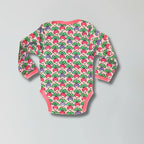 Baby onesie with colorful radish pattern on a gray background
