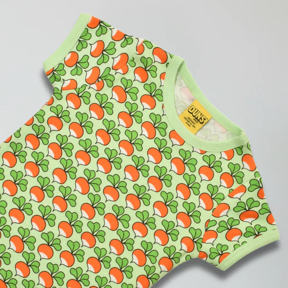Green short sleeve top with radish pattern on a gray background