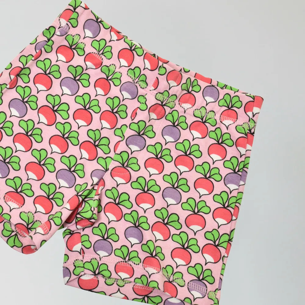 organic cotton shorts with radish pattern on a pink background