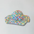 Colorful sun hat with a pattern on a gray background