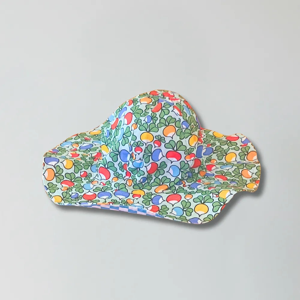 Colorful sun hat with a pattern on a gray background