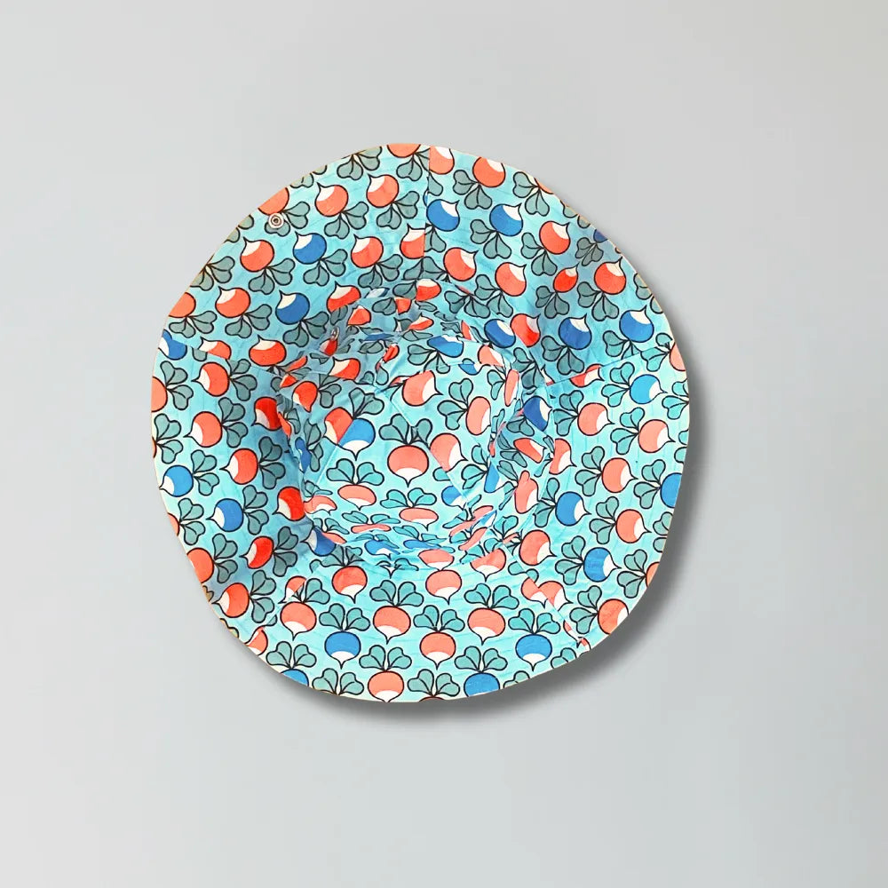 Round colorful hat with a pattern on a gray background