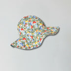 Colorful patterned baby hat on a gray background