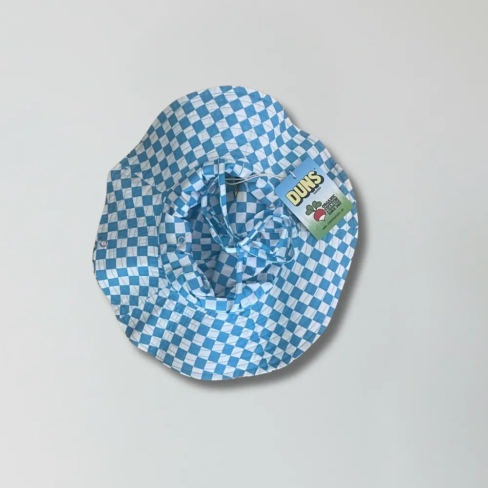 Blue and white checkered bucket hat with a visible brand label on a gray background