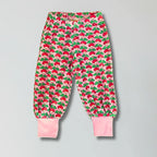 Children's pink pants with radish pattern on a gray background