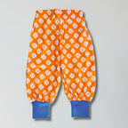 Orange pants with white pattern on a gray background