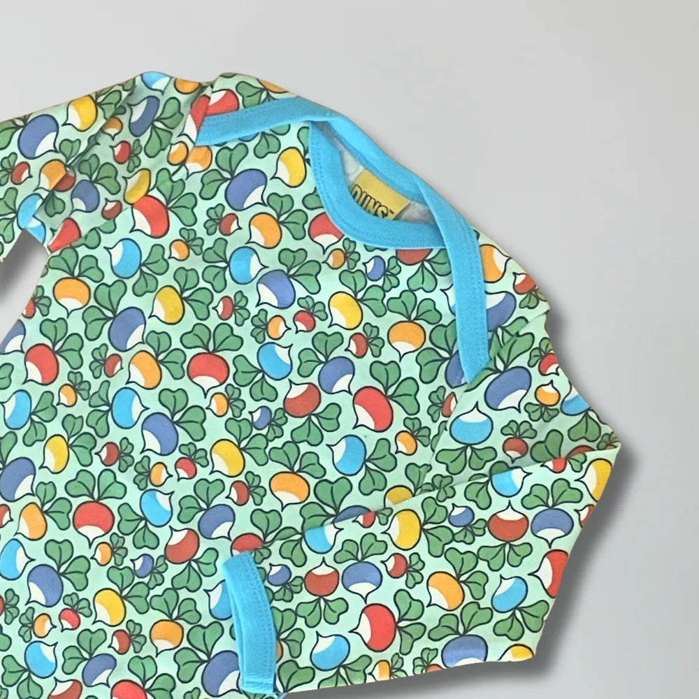Colorful patterned apron with blue straps on a gray background