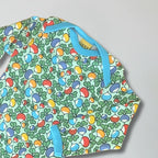 Colorful patterned apron with blue straps on a gray background