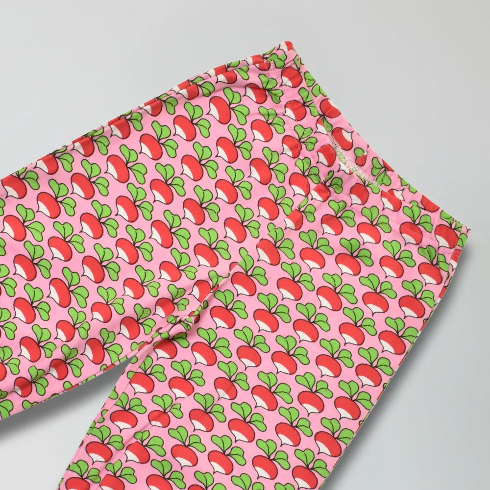 Pink pants with red and green radish pattern on a gray background