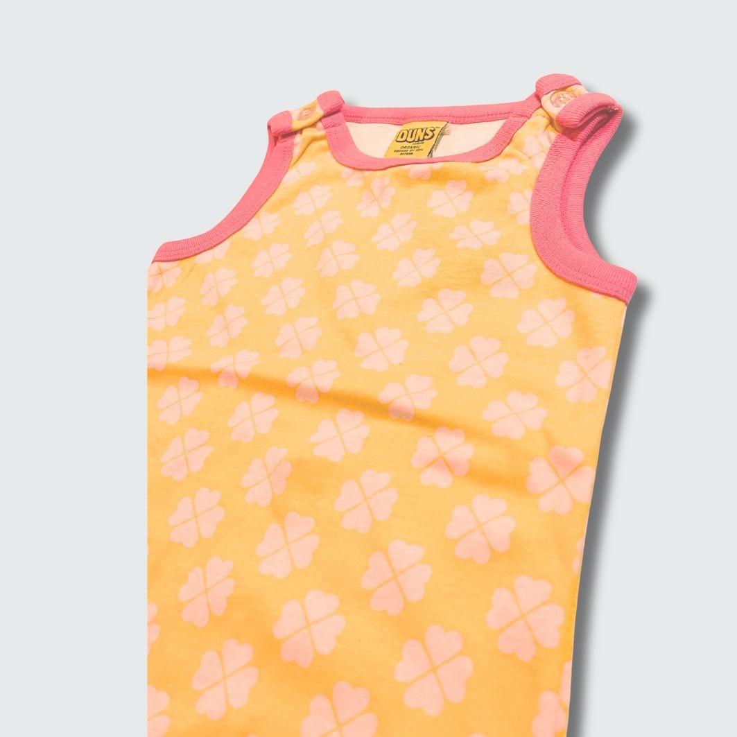 Clover print play suit romper in radiant yellow with hot pink trim, DUNS Sweden – rompers suit, infant clothes unisex