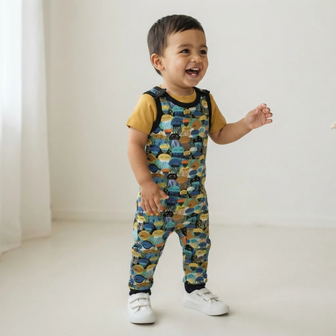 Toddler boy wearing baby dungarees