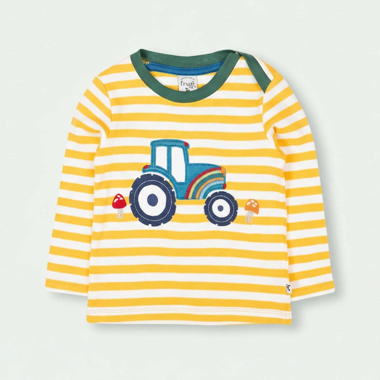 Yellow and white striped long-sleeve shirt with a tractor design on a light gray background