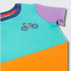 Colorful children's t-shirt with a bicycle design on a gray background