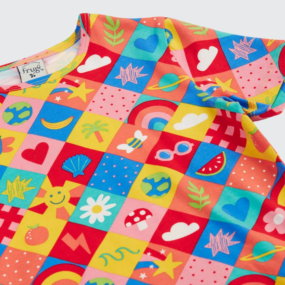 Colorful children's apron with various patterns on a white background