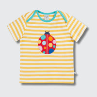 Yellow and white striped t-shirt with a colorful ladybug design on a gray background