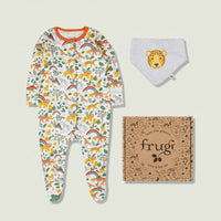 Baby onesie with animal print, bib, and frugi box on a light background