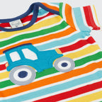 Colorful striped baby romper with a blue tractor design on a white background