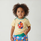 Toddler girl wearing bright organic clothes
