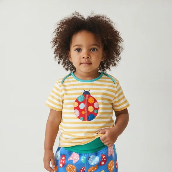 Toddler girl wearing bright organic clothes