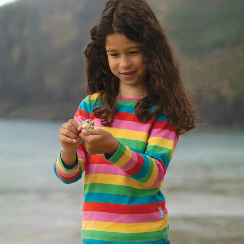 Girl wearing rainbow kids clothes