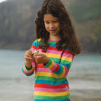 Girl wearing rainbow kids clothes