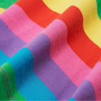 Close-up of the soft stretchy organic cotton and elastane fabric in rainbow stripes