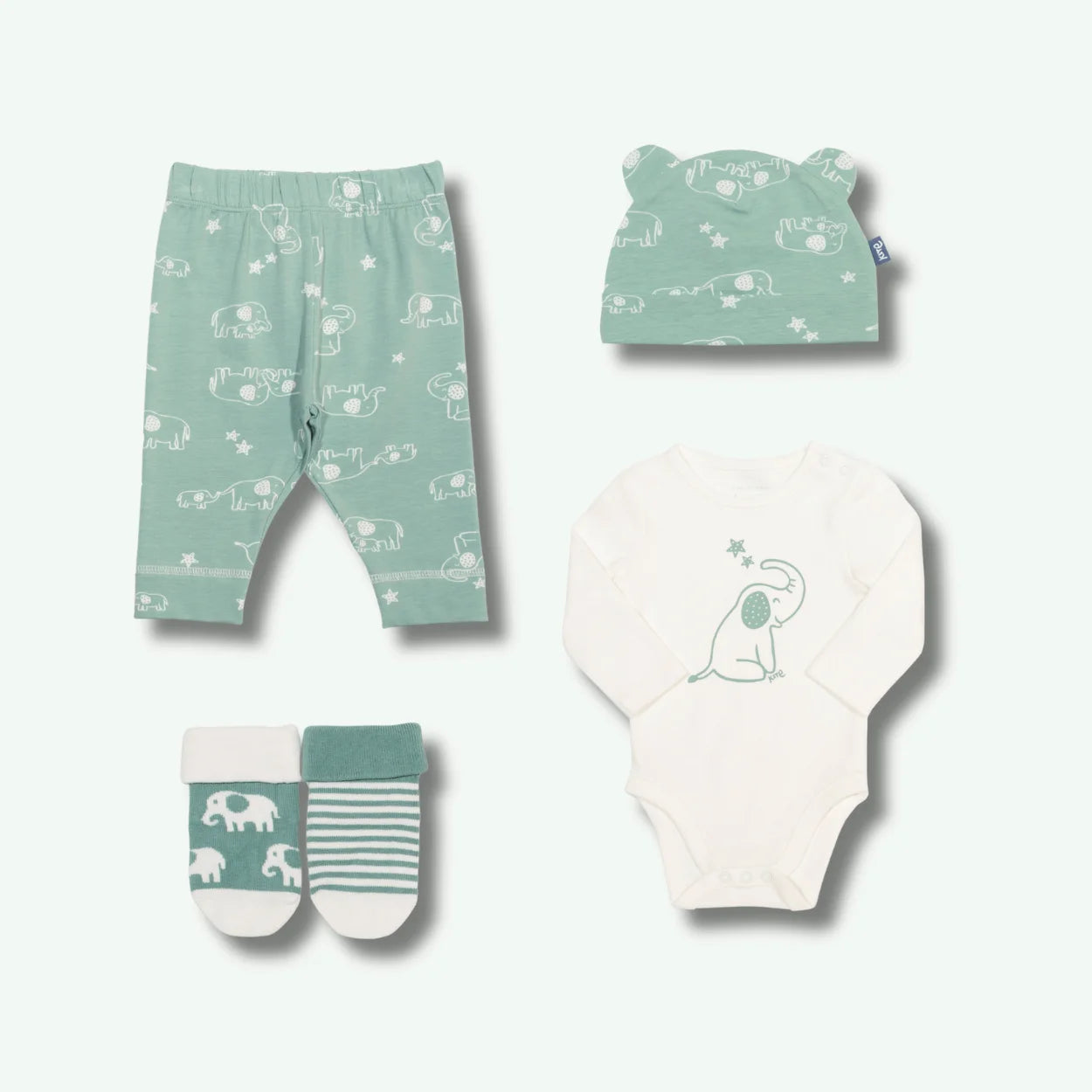 Baby clothing set with pants, hat, onesie, and socks on a white background