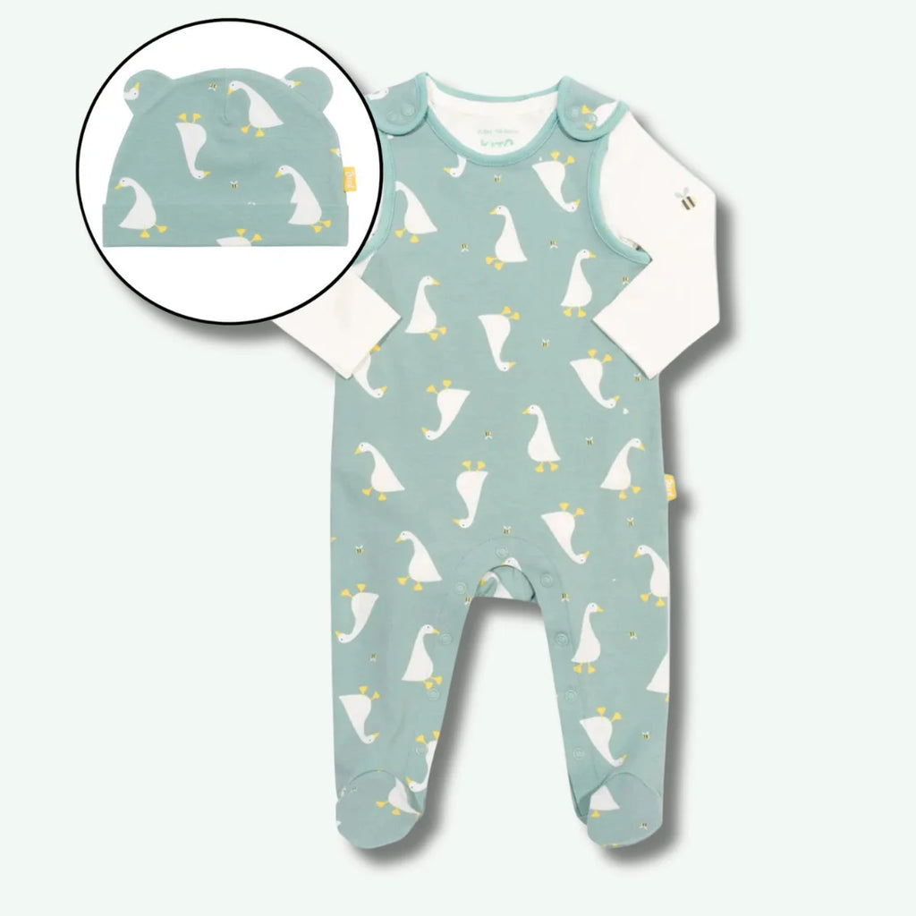 Baby onesie with duck pattern and matching hat on a white background