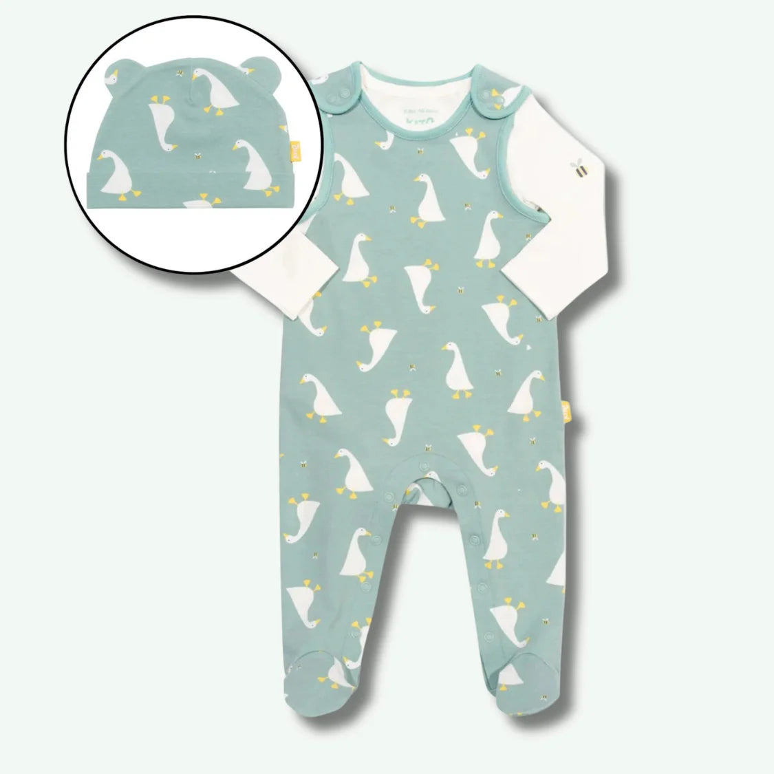 Baby onesie with duck pattern and matching hat on a white background