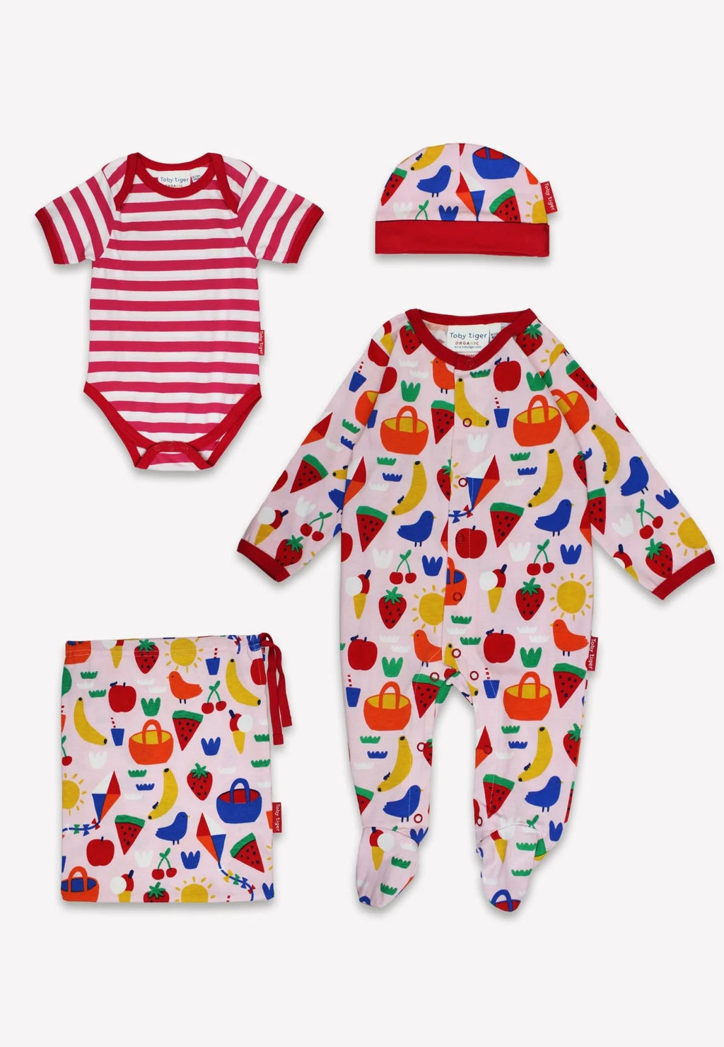 Baby clothing set with striped onesie, patterned romper, and hat on a white background