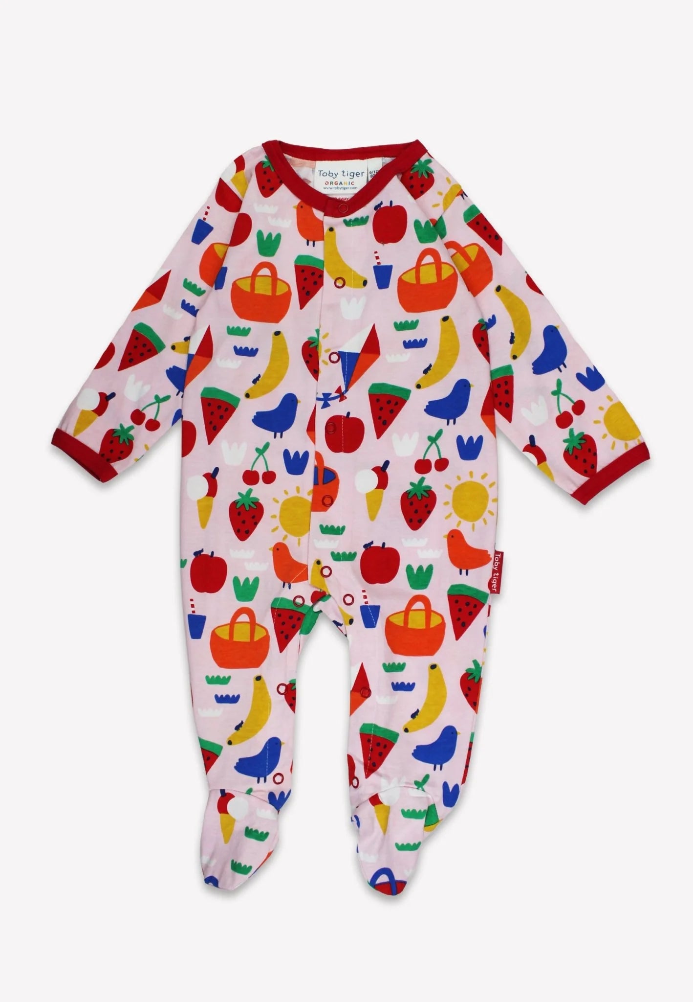 Baby onesie with colorful fruit and vegetable pattern on a white background
